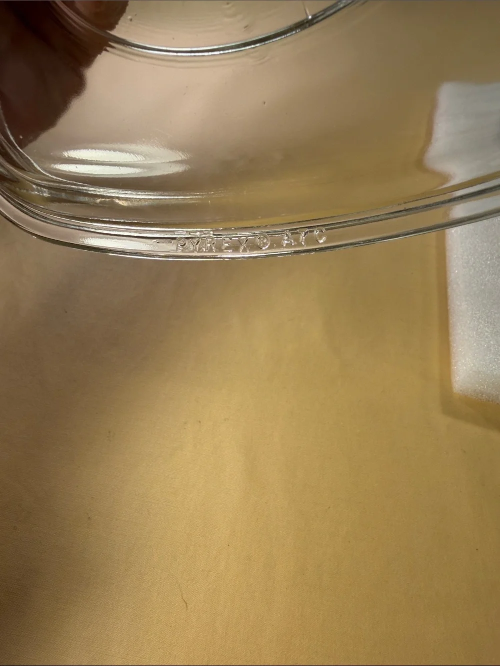 Corning, ware casserole, dish, glass lid, and chrome trivet